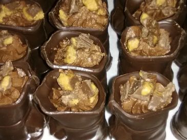 Golf Tournament Catering  Chocolate Golf club bag filled with chocolate cake topped w/ a chocolate m