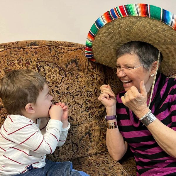 A child and an elder play together at an intergenerational daycare in Washington County