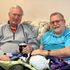 Seniors  find joy in petting goat at an Intergenerational Daycare in Tigard, OR