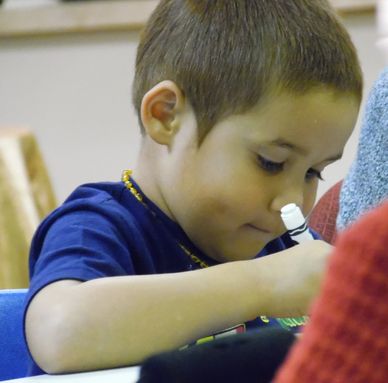 A Child and enjoys Art time at Gentog Intergenerational Daycare in Tigard, OR