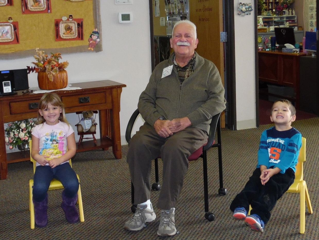 Children and an elder joyfully engage in play at our inclusive daycare facility in Washington County