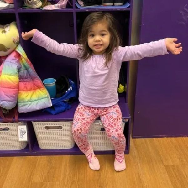 A child enjoys taking a photo at Gentog Intergenerational Daycare