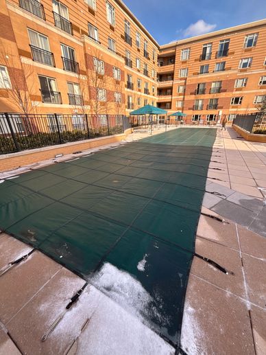 Covered pool in an apartment complex courtyard.