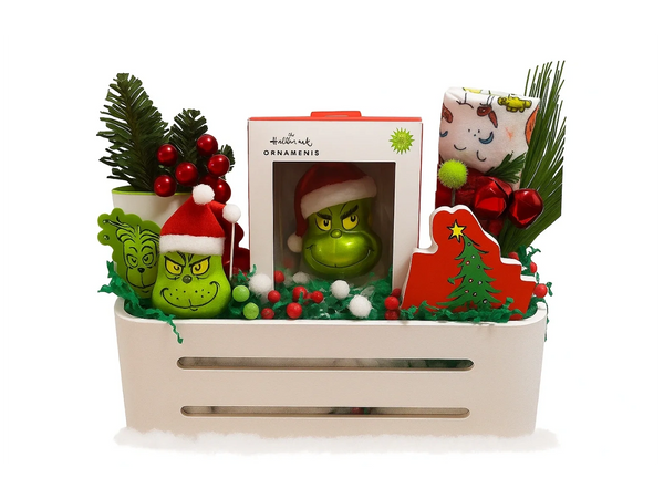 Festive holiday basket featuring Grinch-themed decorations and ornaments.