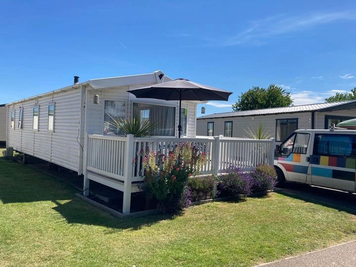 Wilbur, a wheelchair accessible static caravan bathed in sunshine at Caister on Sea Holiday Park.