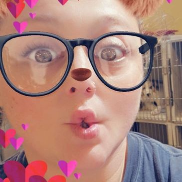 Person with playful dog filter and glasses making a surprised face.