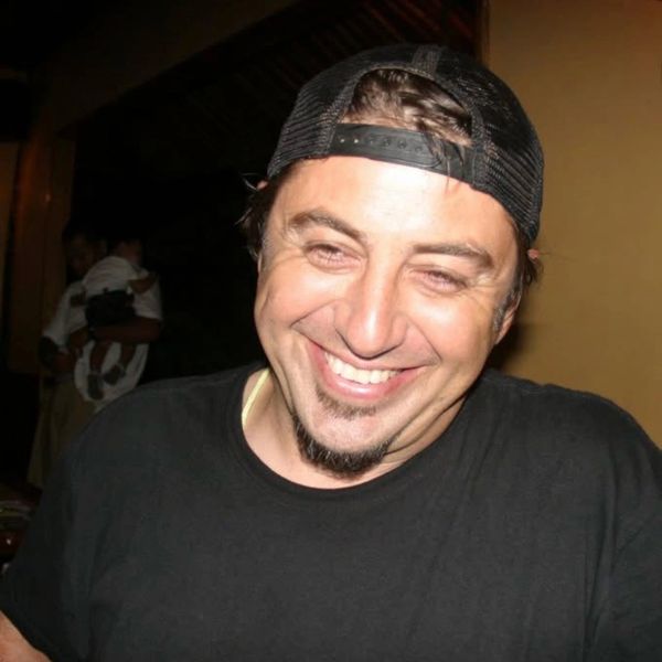 Profile photo of photographer with a big giant infectious smile , expressing joy, laughter, and trus