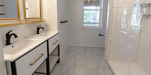 Bathroom with double vanity in Apartment 6