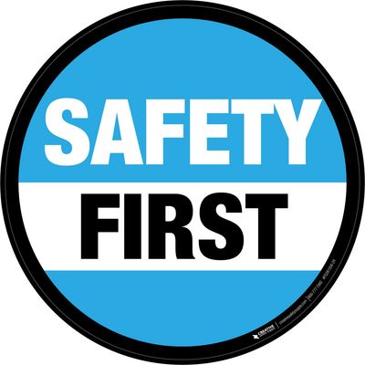 Blue and white circular safety sign saying Safety First.