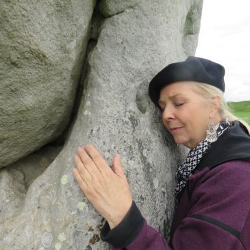 A woman hugging a rock