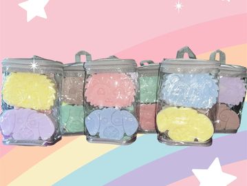 A picture of brightly colored animal shaped soaps in a bag.