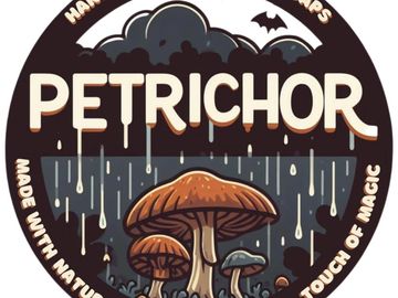 Our main Petrichor label- a mushroom in the rain with the words Petrichor- Handcrafted Artisan Soaps