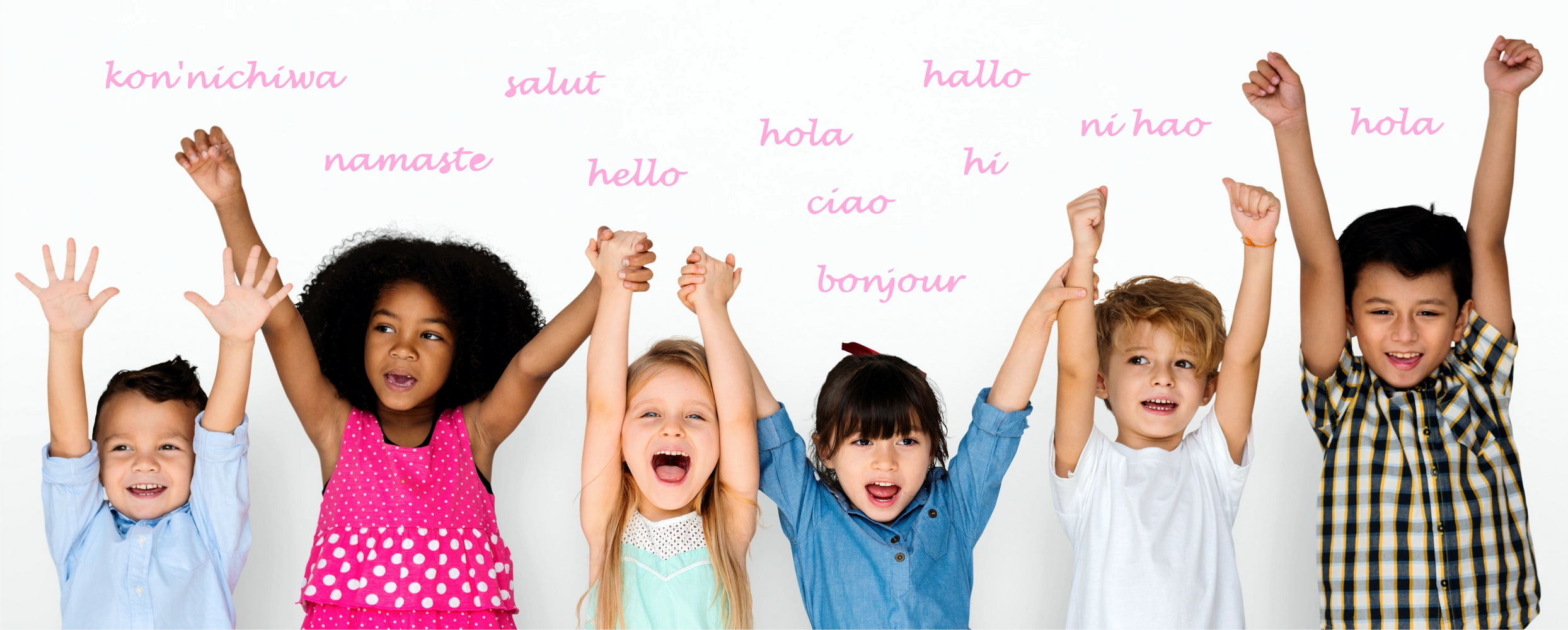 Group of kids smiling with all hands in the air