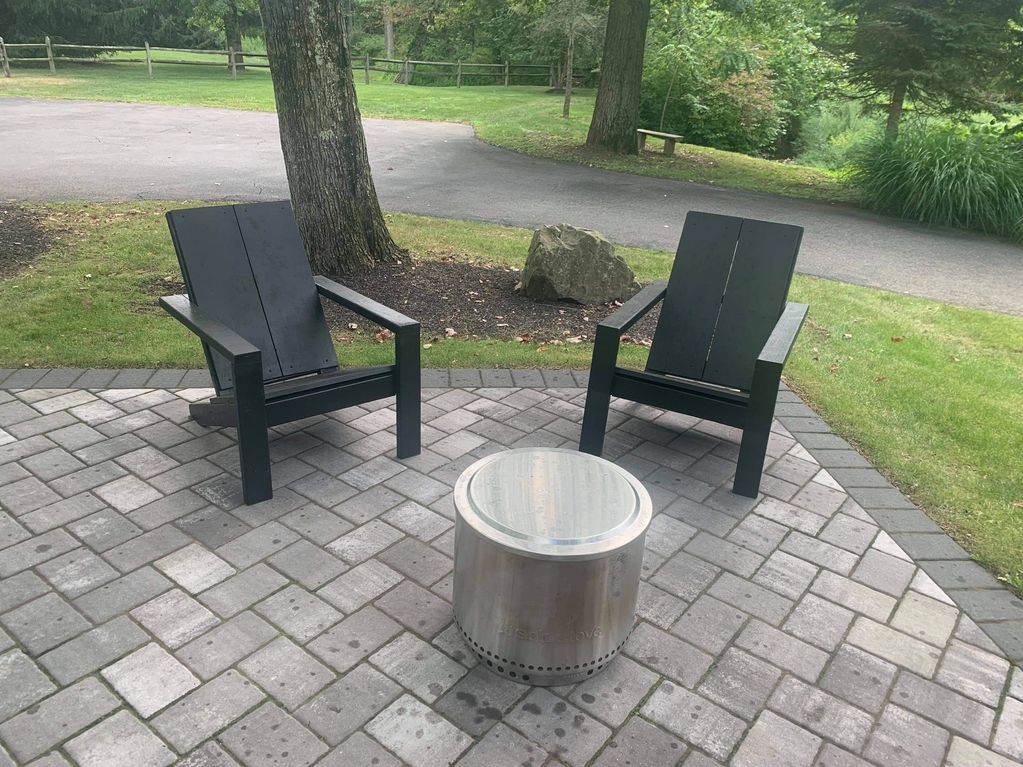 Black Modern Adirondack Chairs with vertical seat backs.