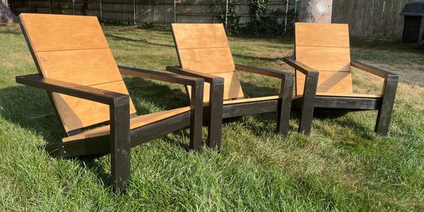 Adirondack Chairs with black frames and Padre Brown stained seat backs.