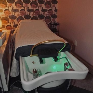 A reclining chair with a built-in foot spa basin.