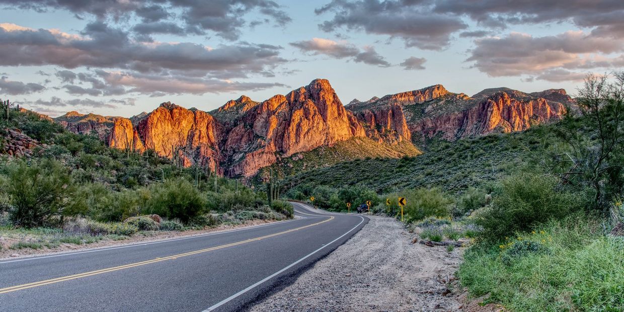 Winding road with mountains in the distance in Mesa Arizona.