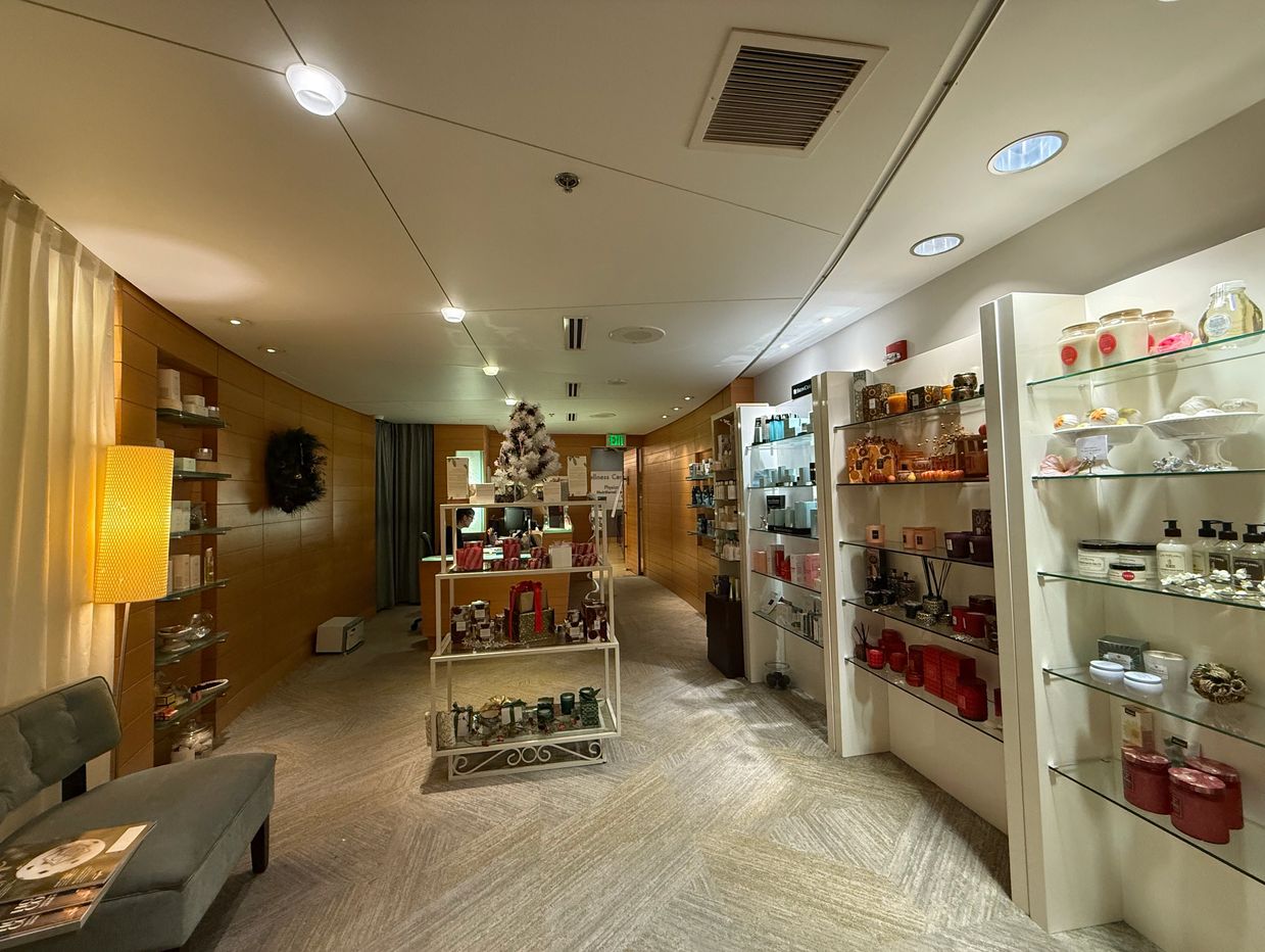 Cozy spa shop with holiday decorations and skincare products.