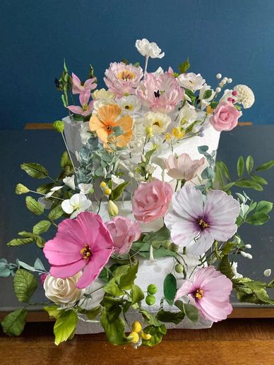 Handmade sugar flowers on a stainless steel table