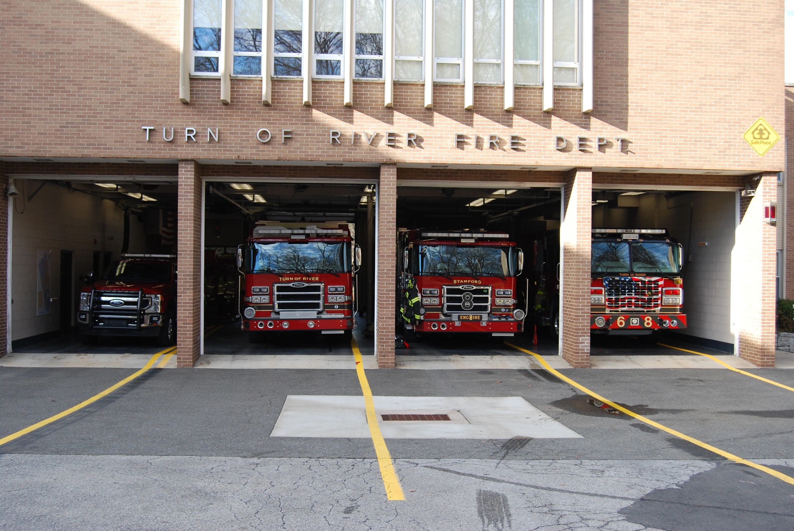 Fire trucks parked inside the Turn of River Fire Department garage.