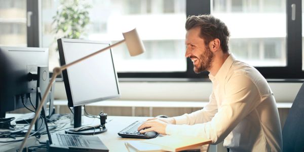 Man smiling at desk