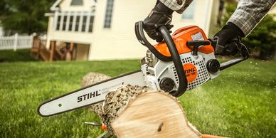 Chainsaw cutting the log