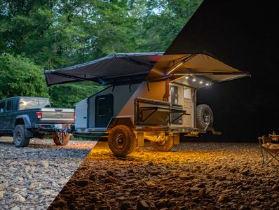 Jeep towing a camping trailer in day and night settings with an awning extended.