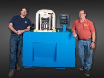 Phil and Rick McCally with a Dynamic Converting System Hydraulic Press