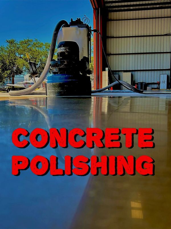 Concrete polishing machine reflecting on a shiny polished floor inside a warehouse.