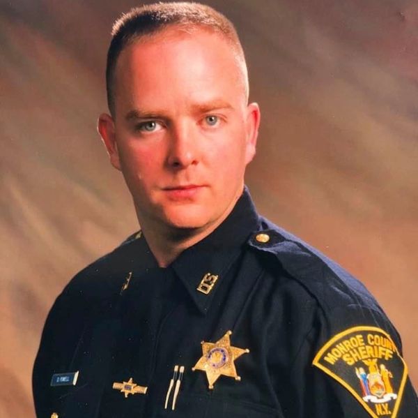 Dan Powell wearing a Monroe County Sheriff's Department Police Uniform.