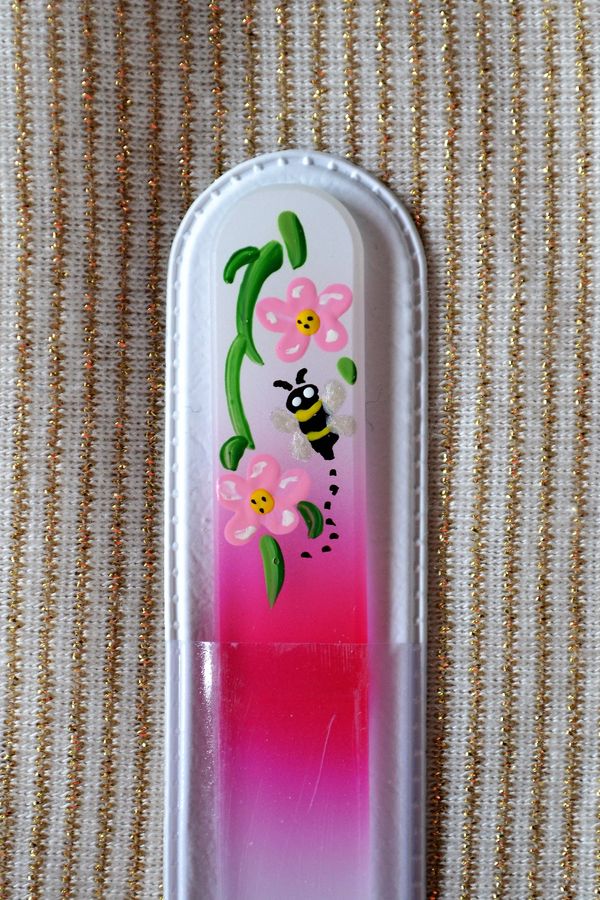 Apple blossoms hand painted on a white/magenta Crystal glass fingernail file. 