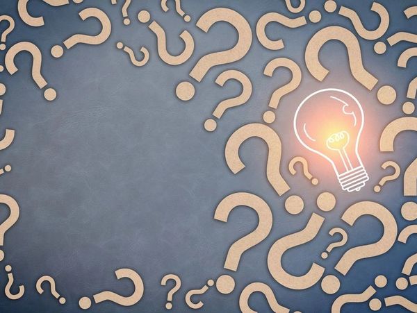 Question marks and bulb on the display