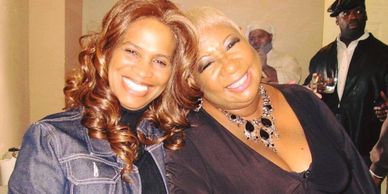 Tina Graham and Comedian Luenell smiling.