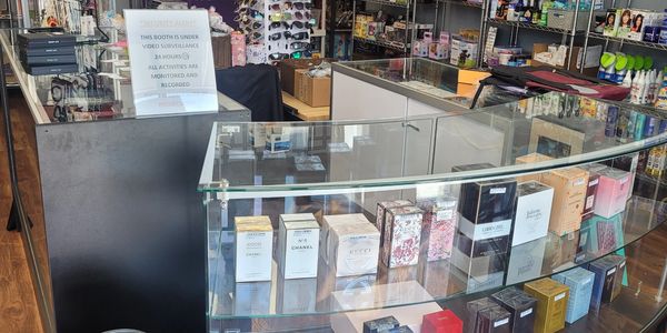 Retail display showcasing perfumes and accessories in a well-organized store.