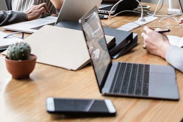 laptop in boardroom meeting