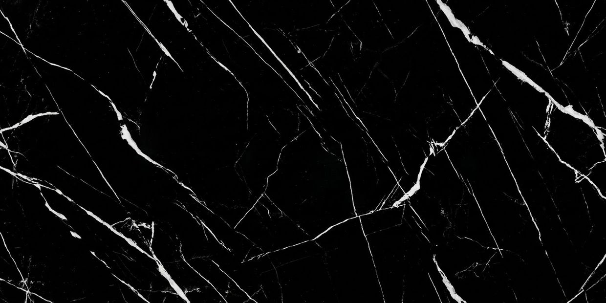 Black marble surface with white veins creating an elegant pattern.