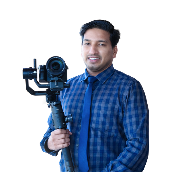 Man in blue shirt holding a professional camera stabilizer.