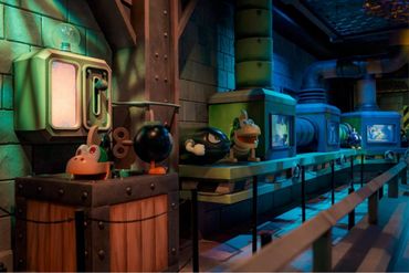 Animatronic characters displayed in a dimly lit, industrial-themed setting.