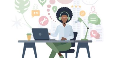 Woman working on laptop at desk with icons floating above.
