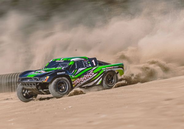 Radio-controlled off-road truck kicking up dust.