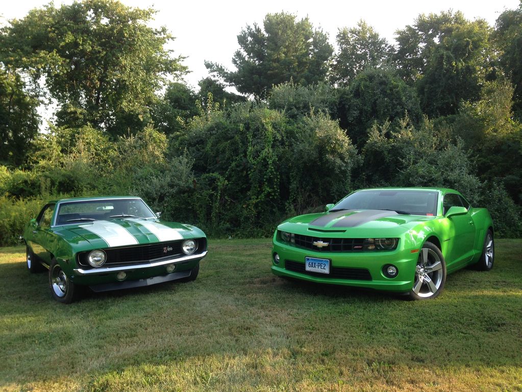 1969 Chevy Camaro Z28 and 2011 Chevy Camaro SS.  