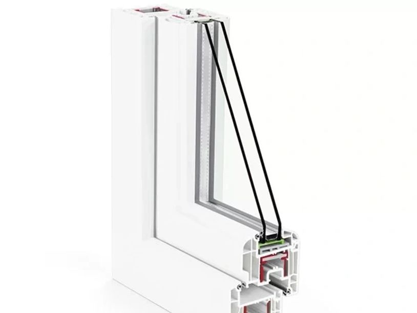 Cross-section of a double-glazed window frame showing insulation layers.