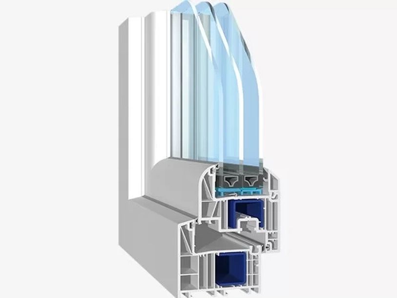 Cross-section of a triple-glazed window frame showing insulation layers.