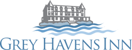 Logo of Grey Havens Inn with a castle and waves.