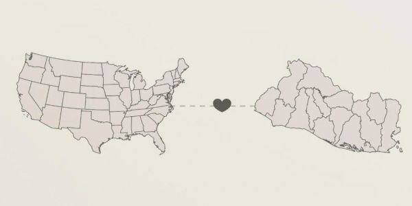 Map of USA and El Salvador connected by a heart symbol.