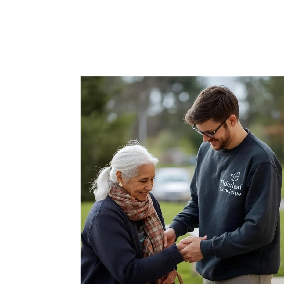 A young man warmly holding hands with an elderly woman outdoors.