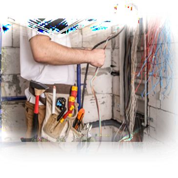 Electrician working with wires inside a building.
