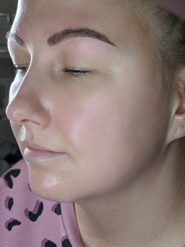 a lady with beautiful hairstroke microblading eyebrows