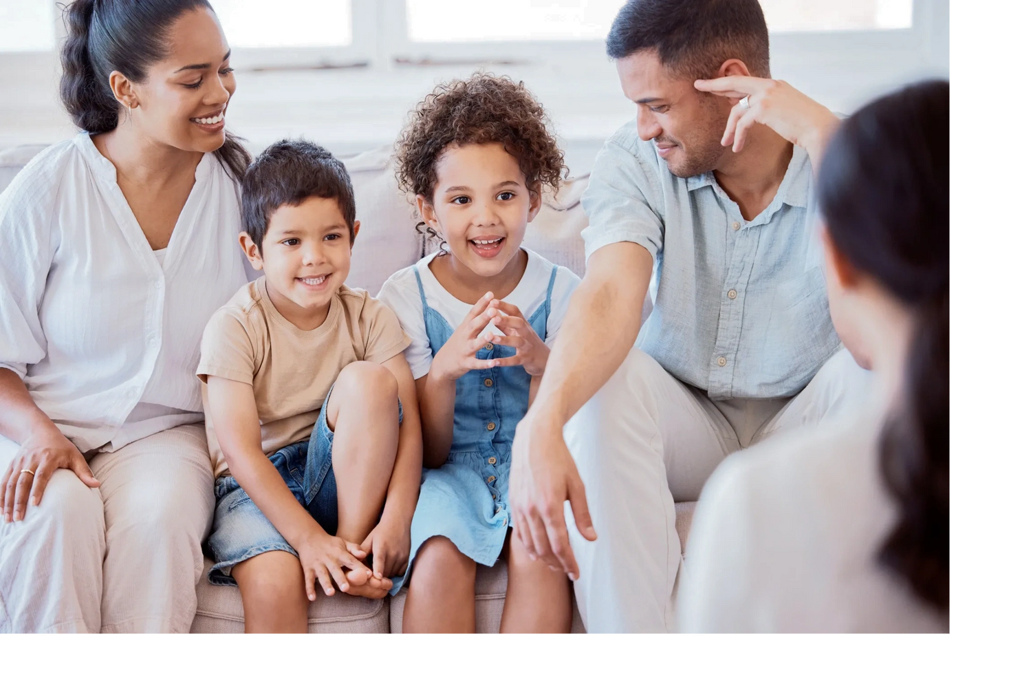 Happy family enjoying quality time together on a couch.