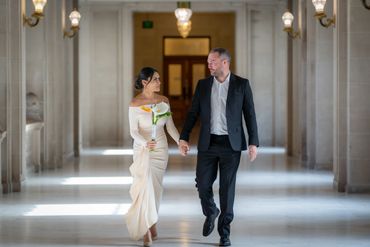 Couple looks at each other prior to wedding at San Francisco City Hall